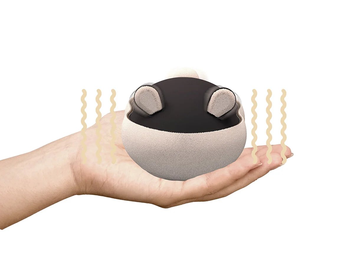 Pet pocket generates heat and vibrates to mimic a heartbeat. It has interactive ears and moving tail to create the experience of a living presence