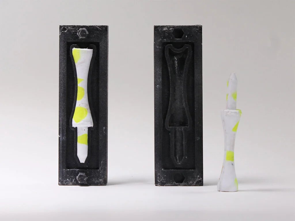 Golf tees are produced out of golf balls using 3D printed nylon moulds