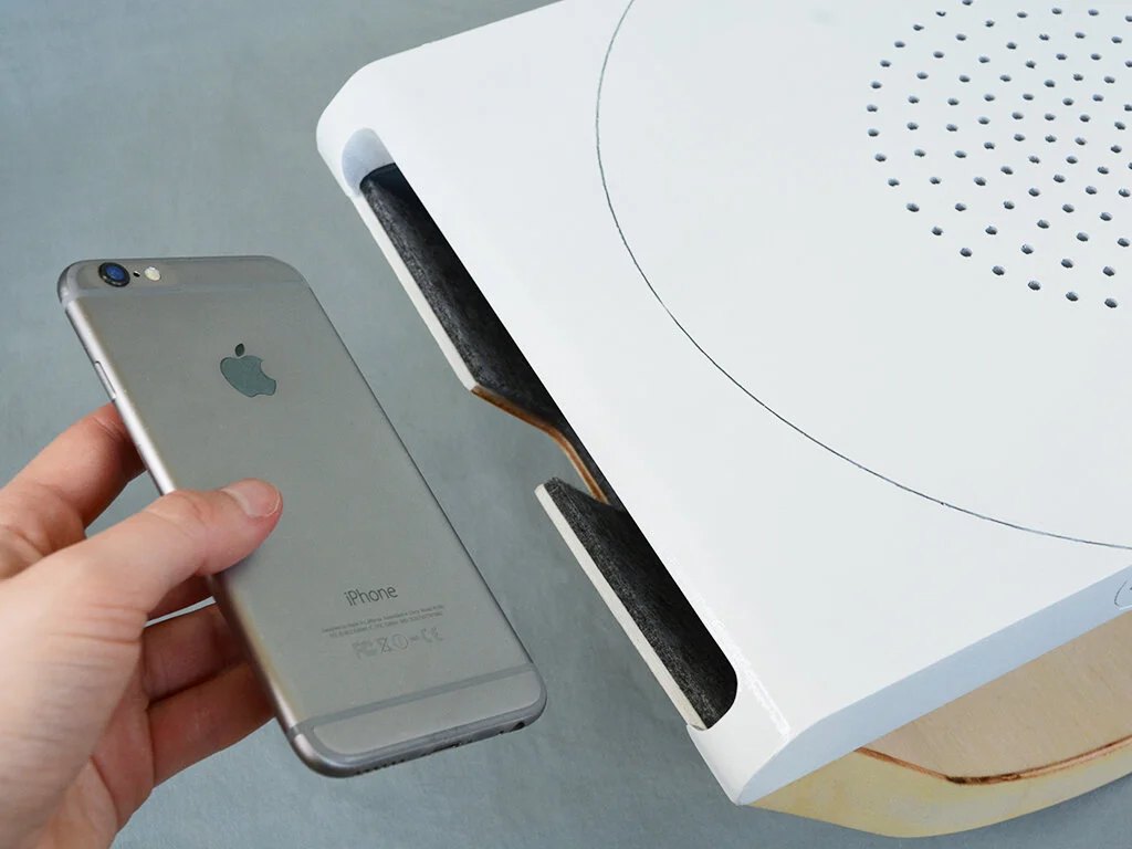 Felt-lined slots keep phones safe and muffle any vibrations from notifications