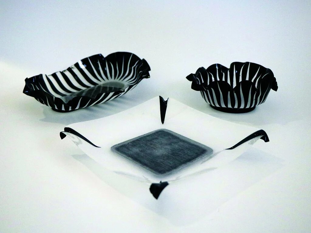The final tray forms highlight the structural integrity of the material and the variety of aesthetics that can be formed