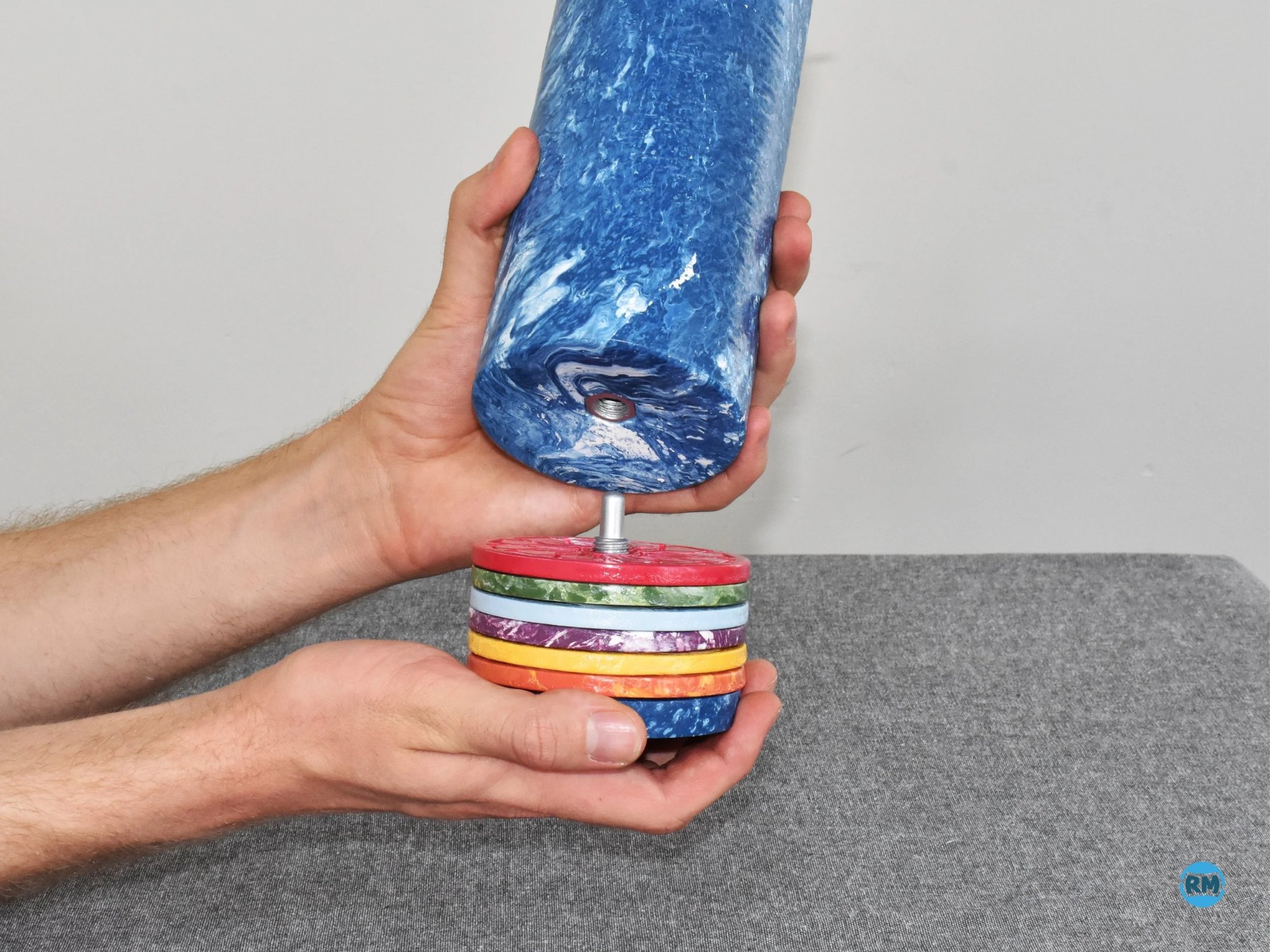 Unscrewing the coaster stack from the vase