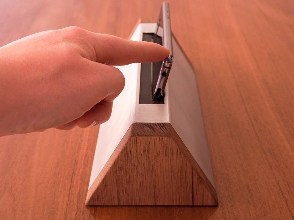 Pause and play is controlled by pushing the phone away from the user