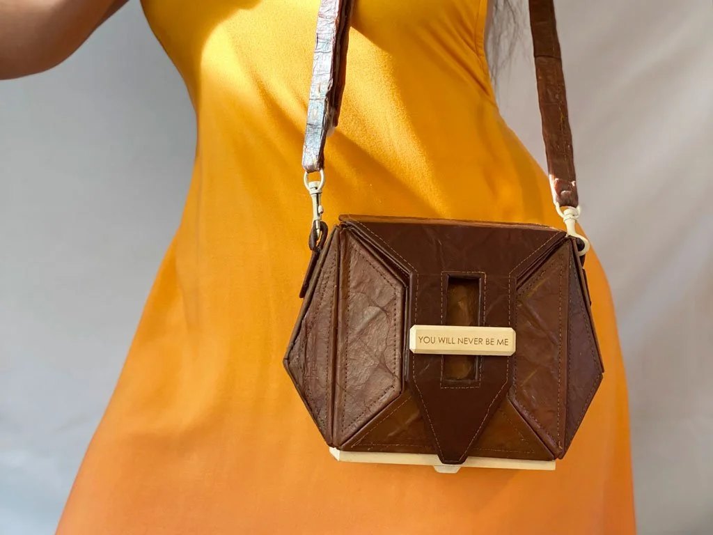 The adjustable strap allows it to be worn in multiple styles; pictured: bag in use as a crossbody.