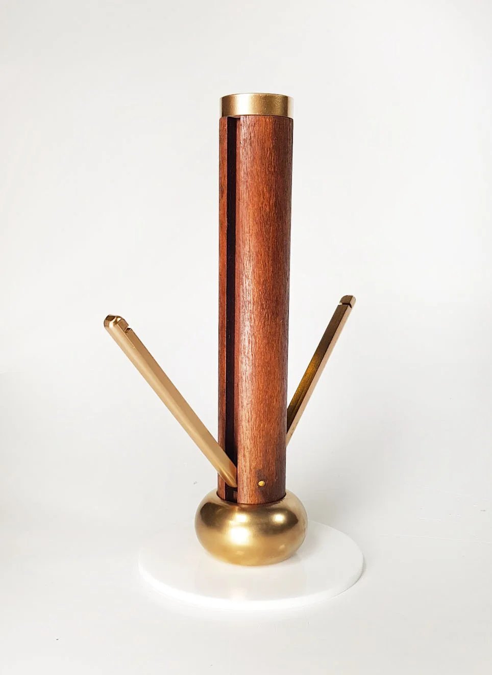 Model of coat stand top section with coat stand hooks extended.