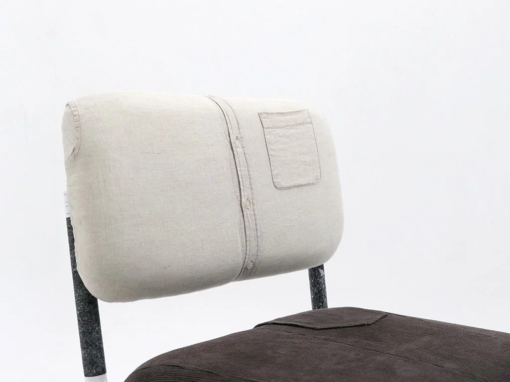 Upholstery done with waste clothing.