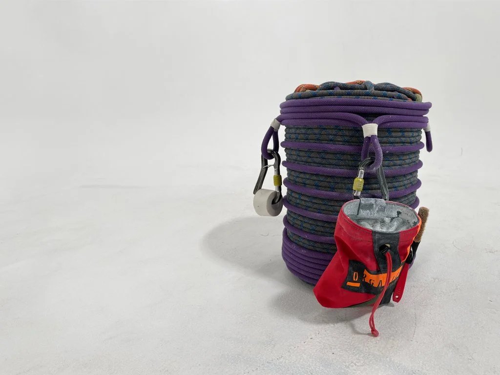 Rope Stool with a chalk bag and climbing tape attached to two of the gear loops.