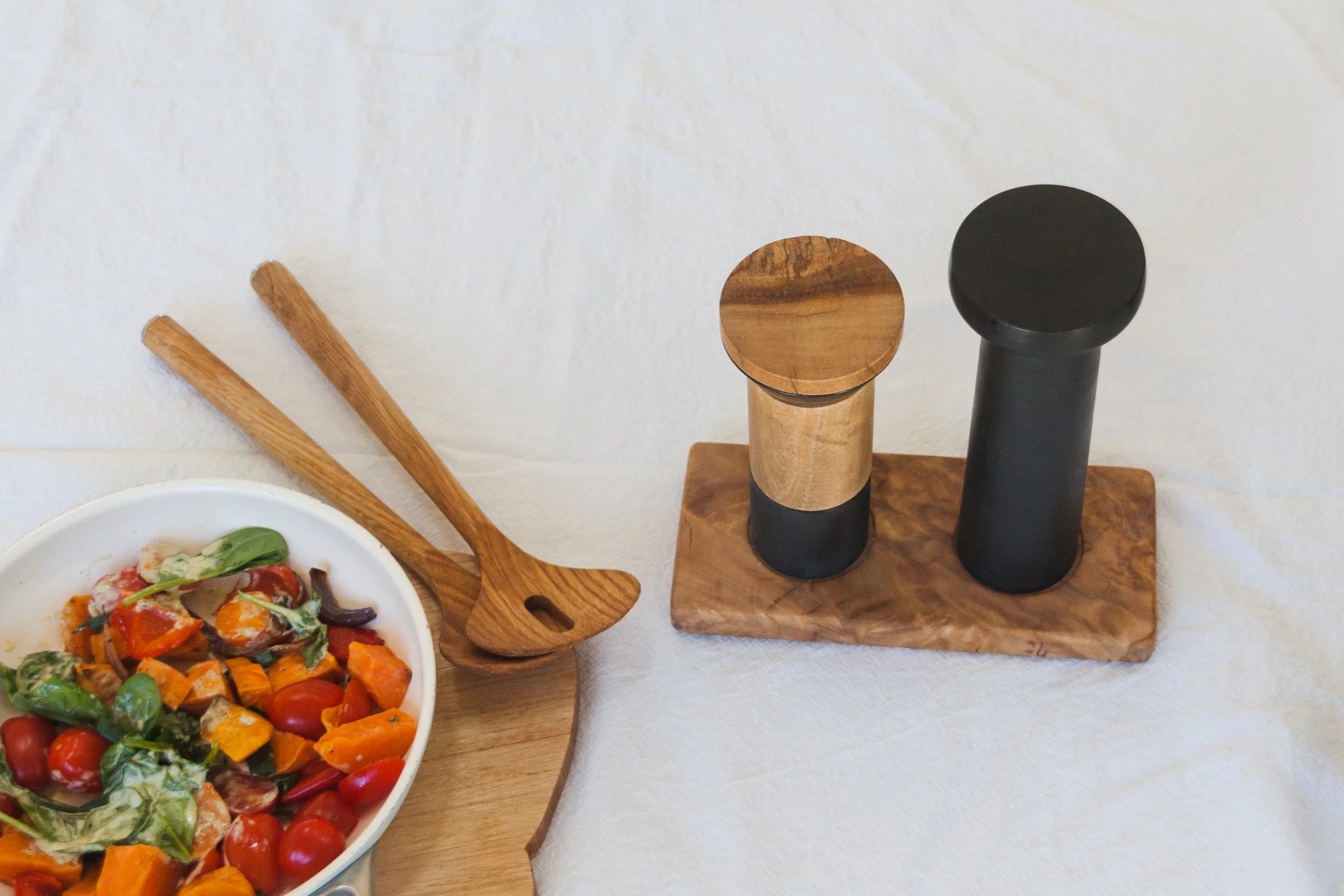 Salt and pepper grinder set in use
