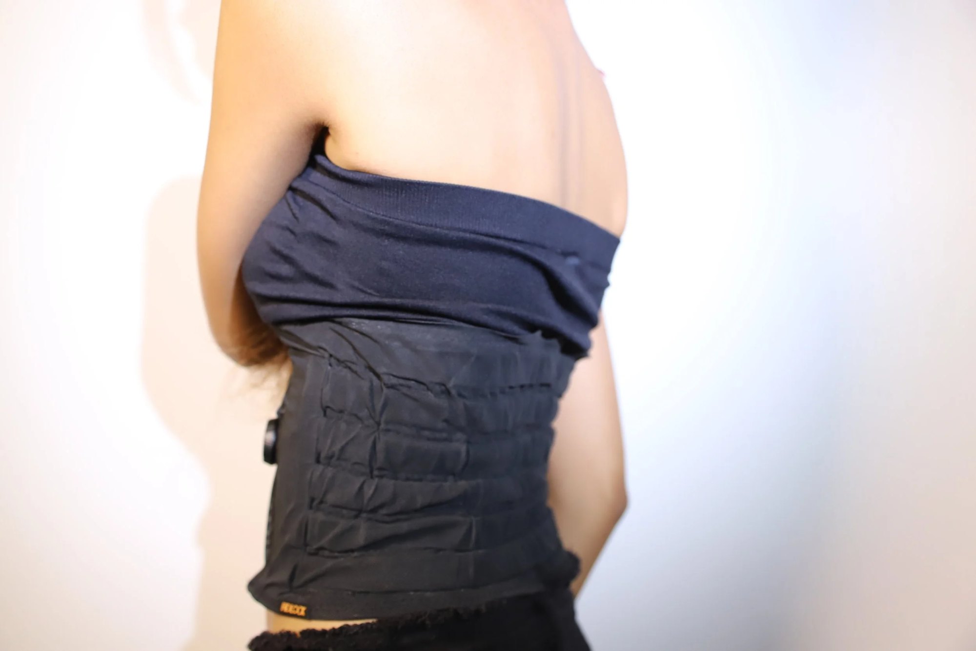 The back view of OM+, showcasing the structured channels designed for even compression distribution.