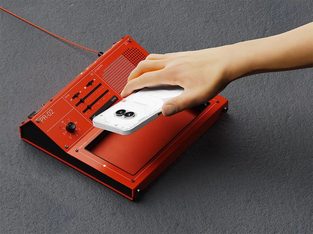 A user placing a Nothing Phone into the PR-02.