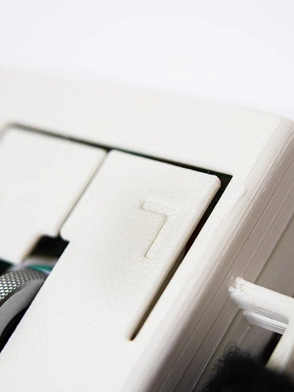 Left-click button on the KomPac Mouse.