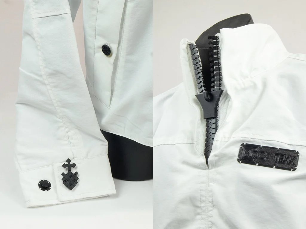 Close up of the snap fit and button fasteners, as well as the zipper and BlockTexx name plate